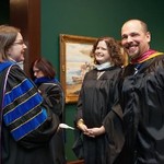 Christine Rener shares a laugh with fellow faculty members